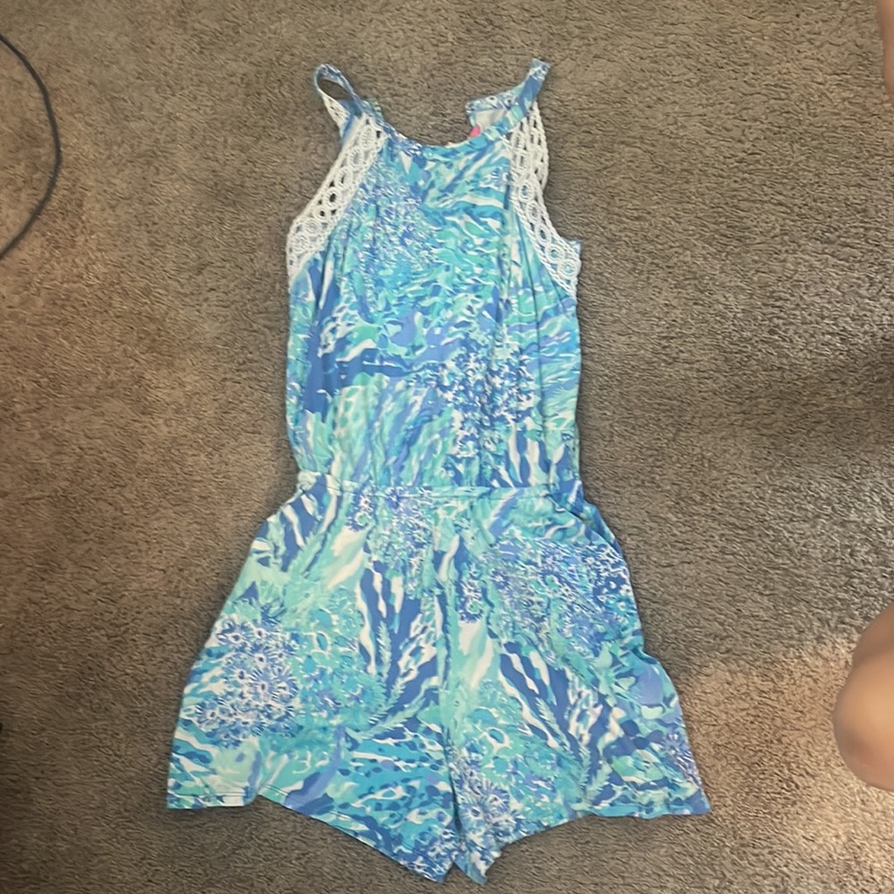 Lilly Pulitzer romper with pockets and embroidered detail.  Very soft.